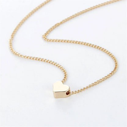 Elegant gold-tone double-sided love pendant necklace with a sleek clavicle chain design