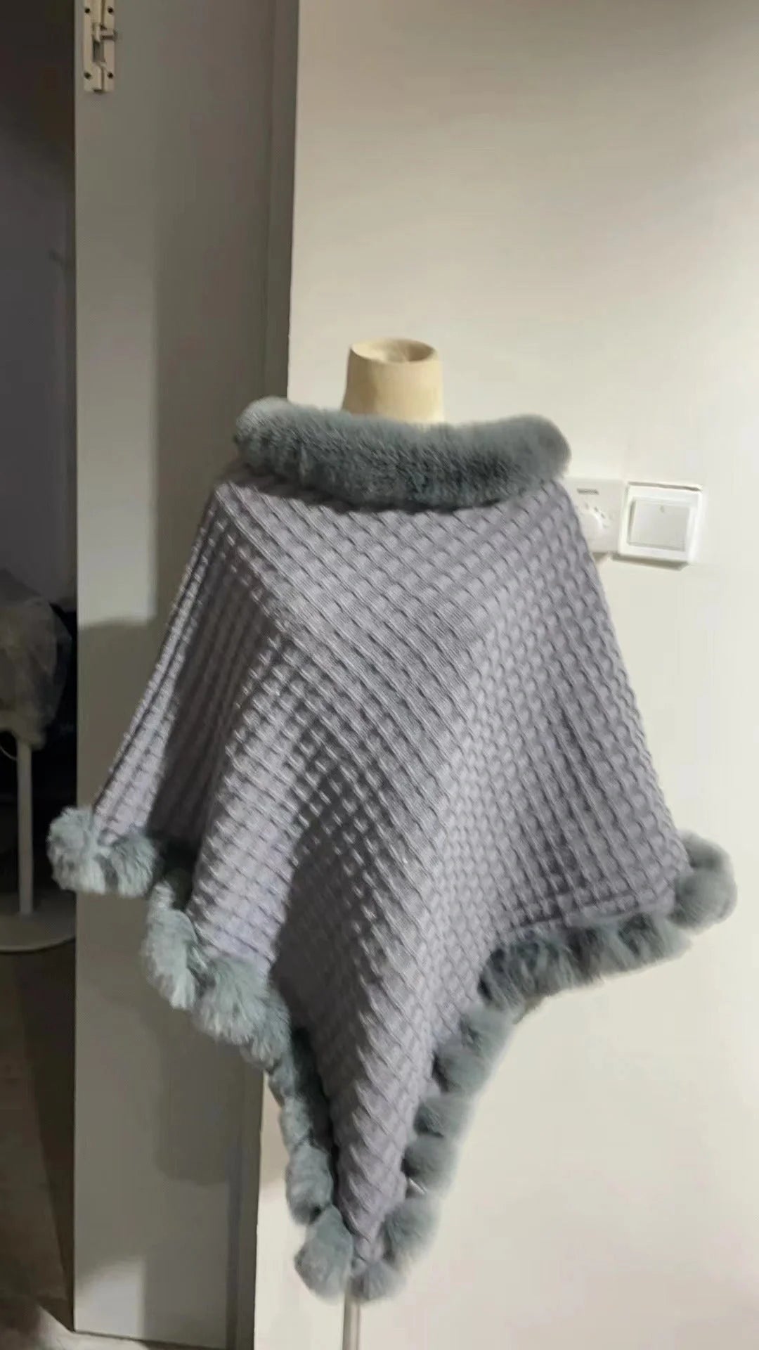 Luxurious rabbit fur wrap shawl in various colours, featuring a soft, cosy collar and a flattering cropped fit for a chic, polished look.