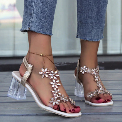 Stylish floral sandals with transparent high square heels for women, available in black and apricot colours