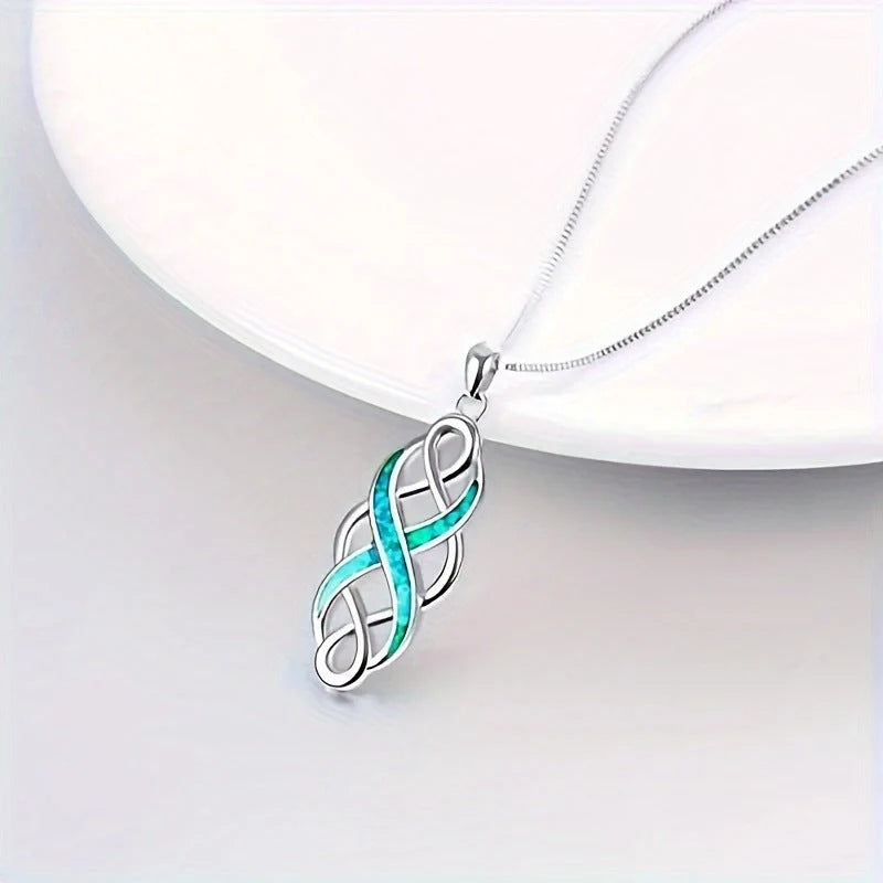 Elegant blue Celtic knot pendant necklace with ellipse and ring design, showcasing the rich cultural heritage of Ireland