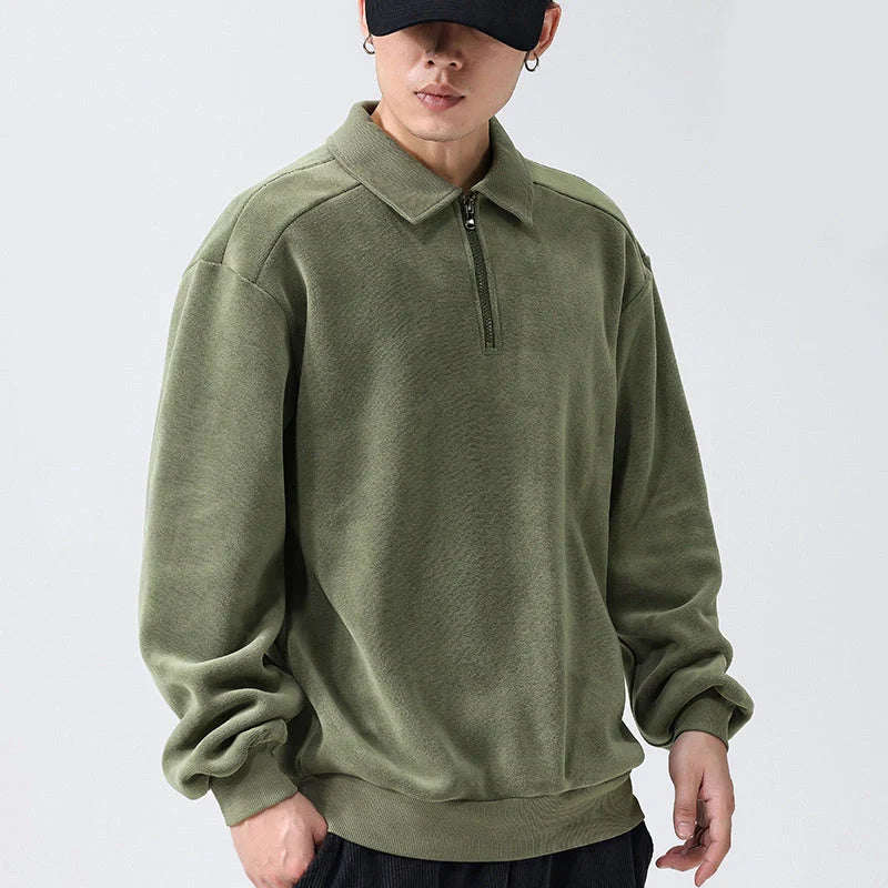 Premium fleece half-zip hoodie in black, haze green, and apricot yellow colours, featuring a tailored design and ribbed details for a refined look.