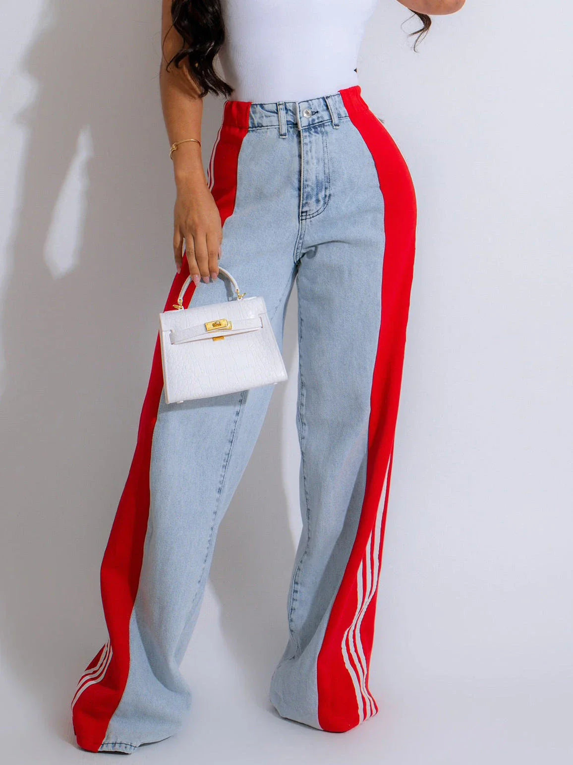 Stylish high-waist denim pants with patchwork details, available in a range of trendy color combinations