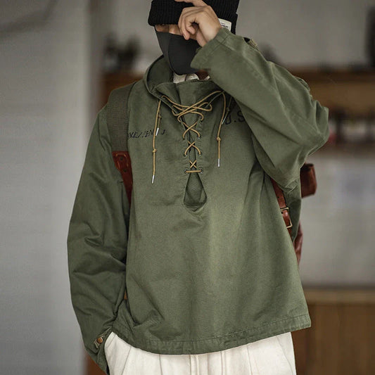 Rugged military-style windbreaker jacket for men, featuring a hooded design, cotton construction, and a classic, streamlined silhouette.