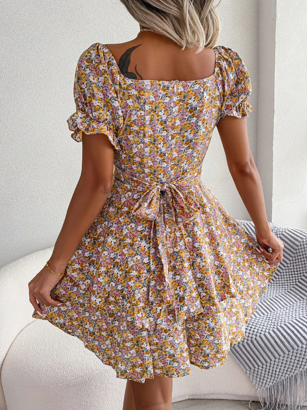 Stylish floral mini dress with A-line silhouette, high waist, and ruffled hem in various vibrant colors