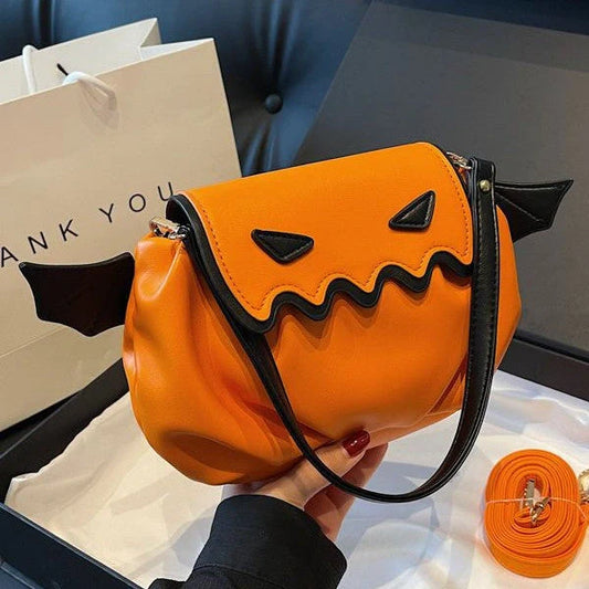Halloween pumpkin cartoon crossbody bag with small wings in black, beige, or orange