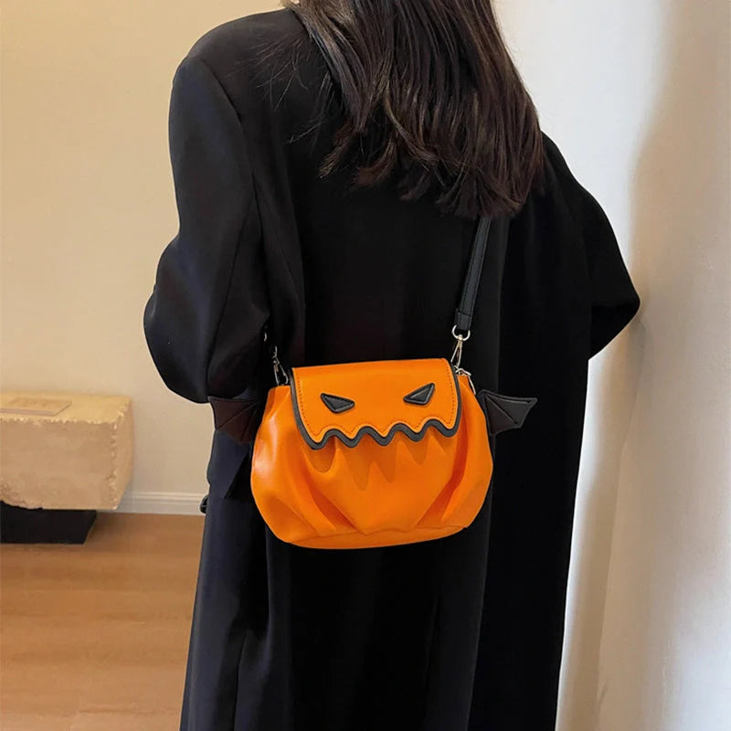 Halloween pumpkin cartoon crossbody bag with small wings in black, beige, or orange