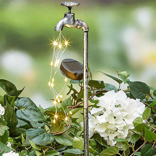 Solar-powered garden lamp with water faucet design for outdoor decoration