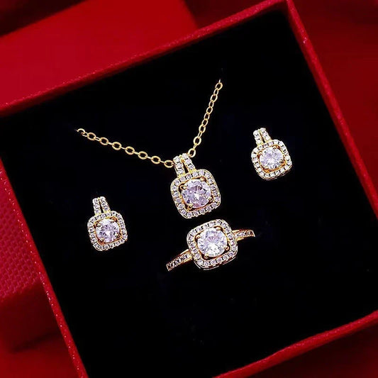 Elegant gold-toned jewelry set with zircon gemstone pendant necklace, stud earrings, and statement ring