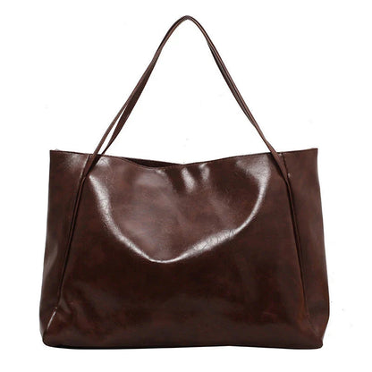 Premium faux leather shoulder bag in various colors, featuring a classic silhouette and roomy interior for everyday convenience.