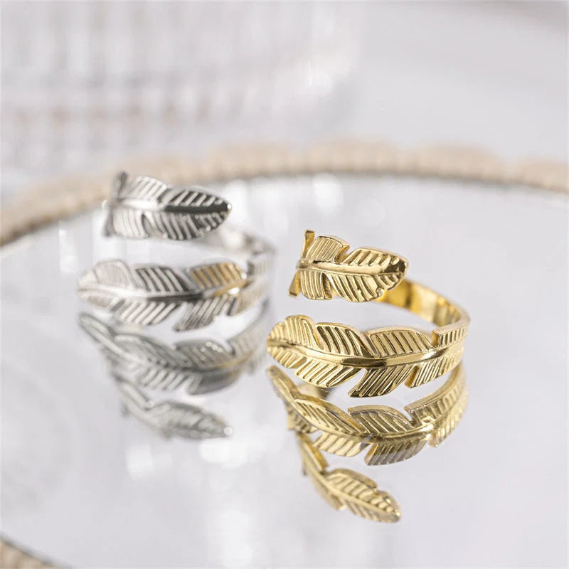 Feather-themed titanium steel open ring in gold and silver colours, with an adjustable design and elegant geometric shape