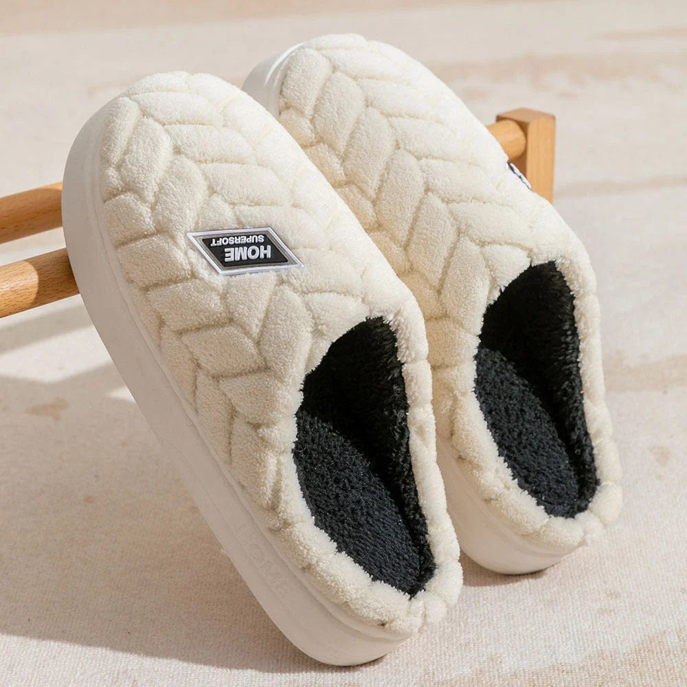 Cosy plush slippers in a variety of vibrant colours, featuring a soft fleece lining and durable non-slip sole for maximum comfort and stability.