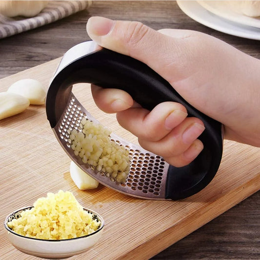 Stainless steel garlic press with ergonomic handle for easy mashing
