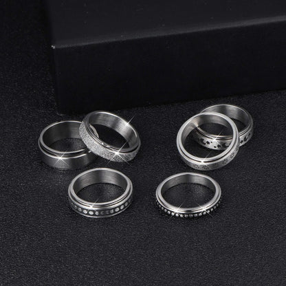 Elegant stainless steel spinner ring with a captivating moon and star design that rotates effortlessly for a calming tactile experience