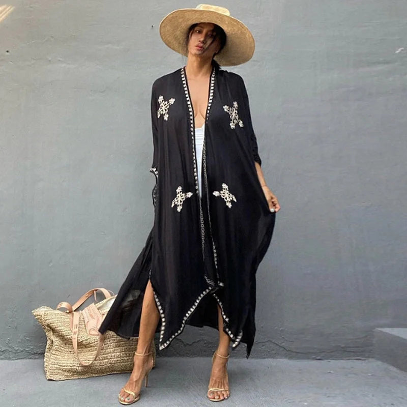 Fashionable rayon beach cardigan with vibrant embroidered design, offering sun protection and versatile style for coastal holidays