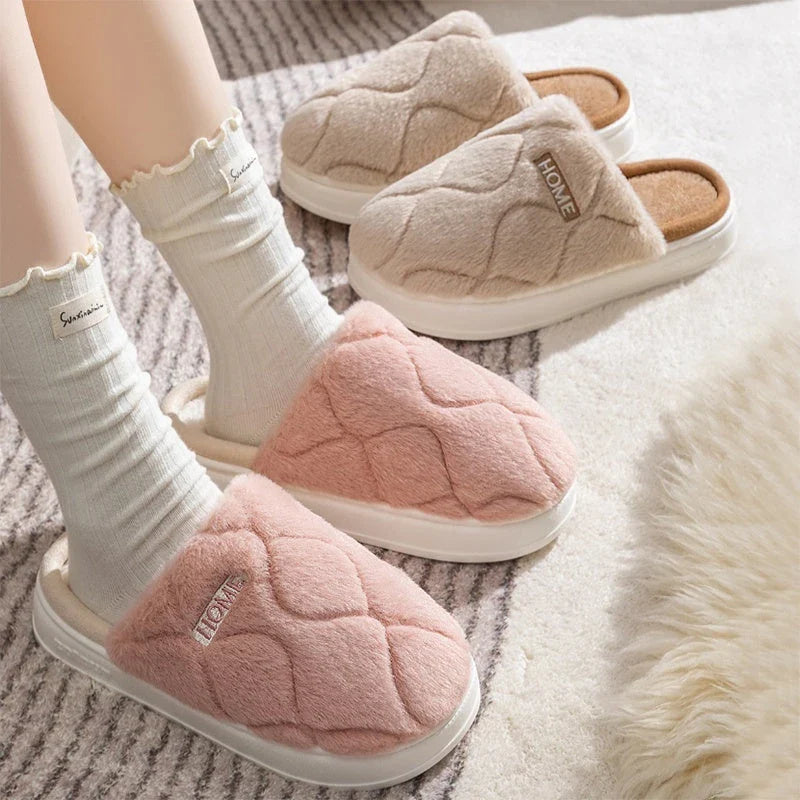 Plush slippers with soft, cushiony upper and durable PVC sole for cozy indoor comfort and traction