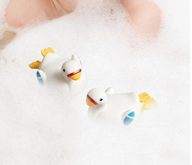 Charming wind-up bath toys featuring a goose and dolphin design, made of durable ABS plastic for safe and fun water play
