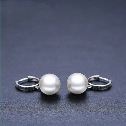 Trendy copper ball stud earrings with a minimalist design, showcasing a sleek and modern accessory for fashion-forward women