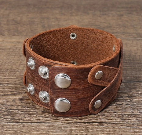 Vintage-inspired brown leather bracelet with geometric shapes and multi-layered design
