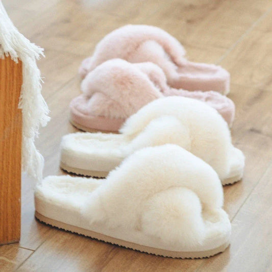 Cosy faux fur slippers in a variety of classic British colours, featuring a stylish cross-over design for indoor comfort and sophistication.