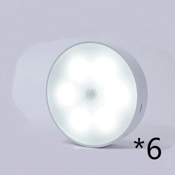 Motion-activated LED puck lights in warm and white color options, with various pack sizes and USB recharging