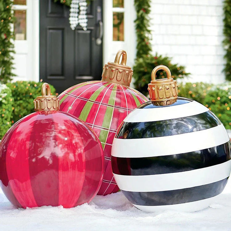 Vibrant inflatable Christmas baubles in a variety of colours and patterns, perfect for outdoor holiday decoration