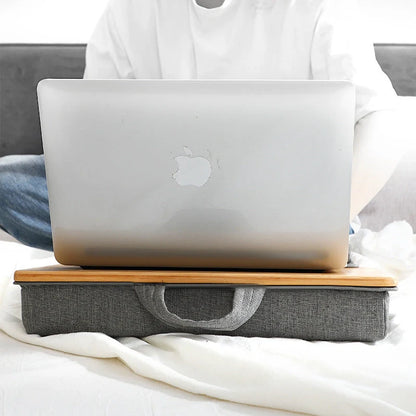 Elegant bamboo lap desk with cushioned surface and card slots for relaxing laptop use