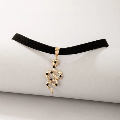 Witchy Gothic Grunge Velvet Choker Necklace in silver and gold with baroque snake design