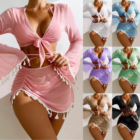 Solid colour bikini set with short skirt and long sleeve cover-up, featuring bow tie and fringe details