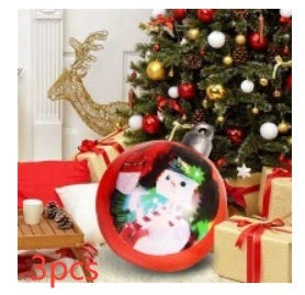 Vibrant inflatable Christmas baubles in a variety of colours and patterns, perfect for outdoor holiday decoration