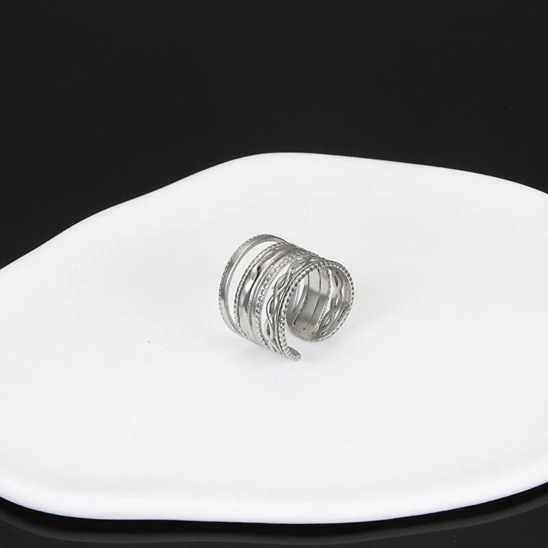 Adjustable stainless steel finger ring with unique charm designs