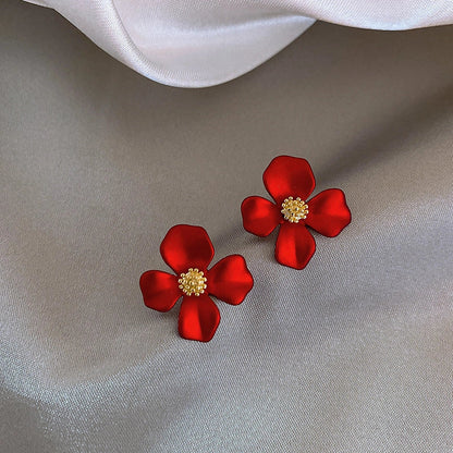 Elegant silver earrings with delicate red petal design inspired by Korean fashion