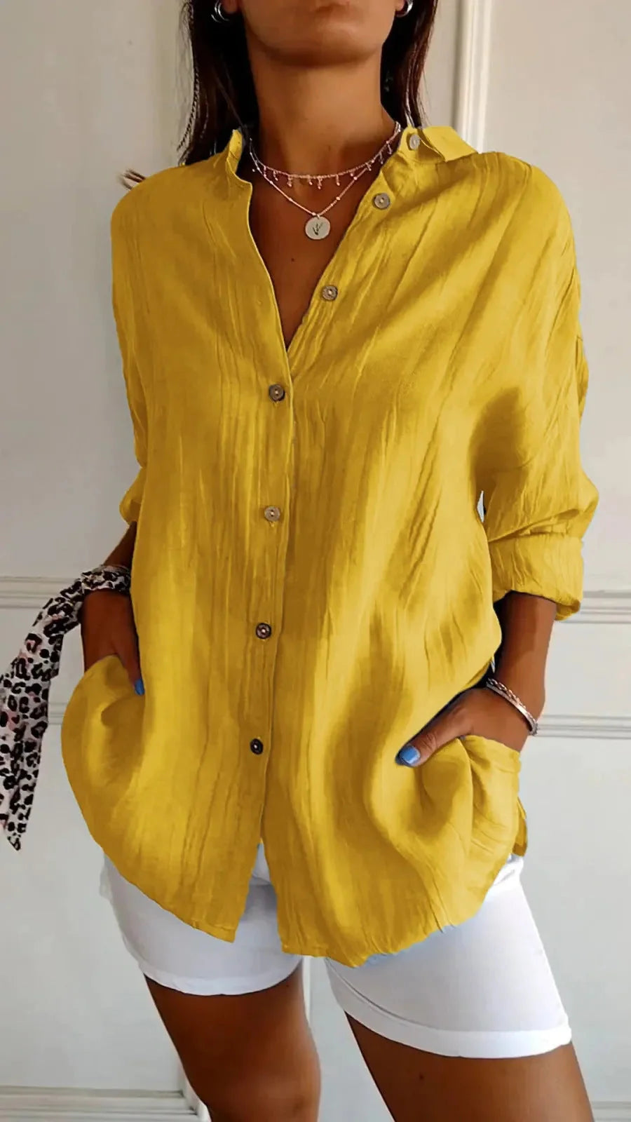 A stylish long-sleeved shirt with a pleated design, available in a variety of colours to suit any occasion.