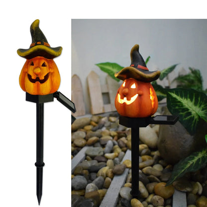 Solar-powered Halloween pumpkin lanterns in garden setting