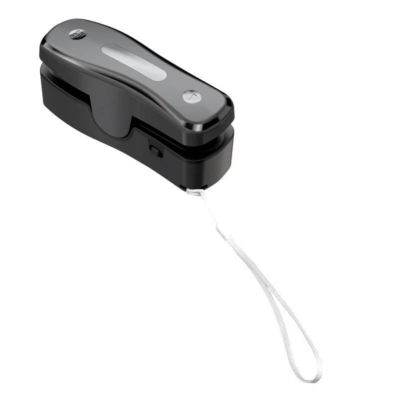 Compact USB mini sealing machine for kitchen food preservation in black and milky white