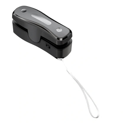 Compact USB mini sealing machine for kitchen food preservation in black and milky white