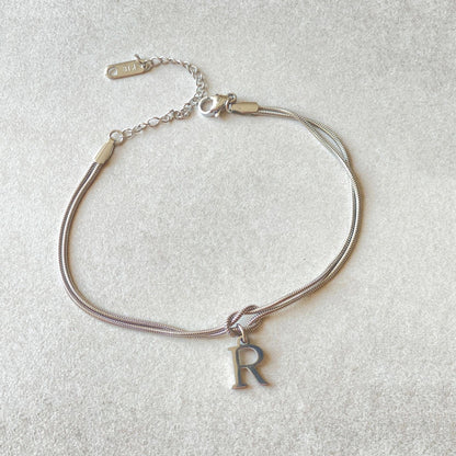 Personalised gold and silver love knot bracelets for couples, perfect as Valentine's Day gifts.