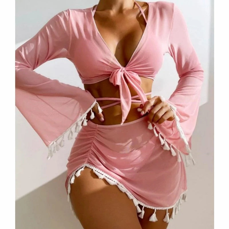 Solid colour bikini set with short skirt and long sleeve cover-up, featuring bow tie and fringe details