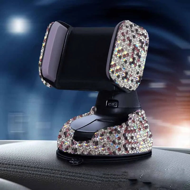 Diamond-encrusted car phone holder mounted on air vent with phone securely in place