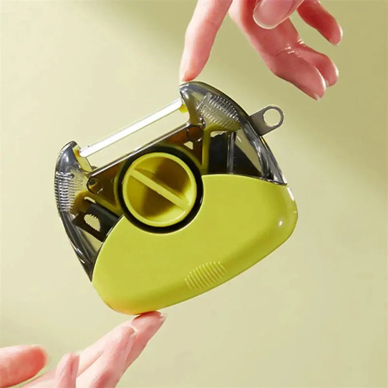 3-in-1 Stainless Steel Peeler Shredder in green and grey with ergonomic handle