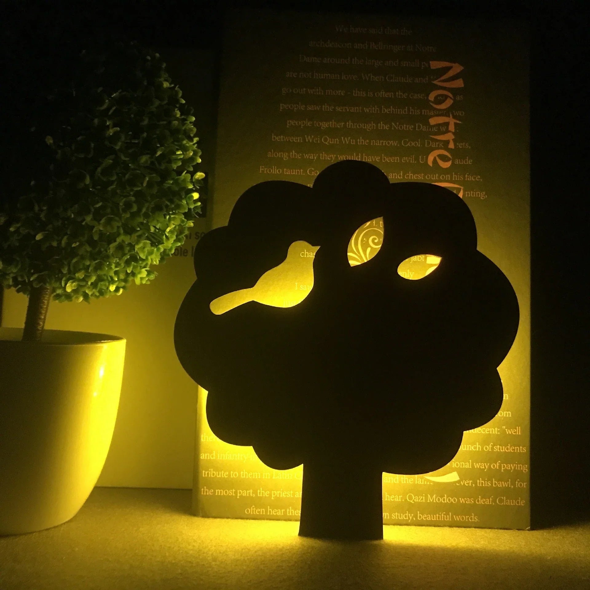 A stylish cat-shaped smart sensor night light that automatically illuminates a room when motion is detected, creating a warm and cozy atmosphere.