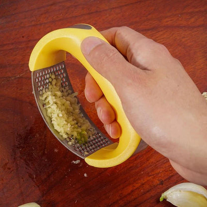 Stainless steel garlic press with ergonomic handle for easy mashing