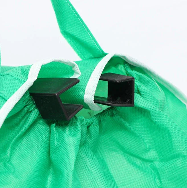 Reusable eco-friendly folding shopper bag in green colour, with generous front pocket and durable, mold-resistant construction