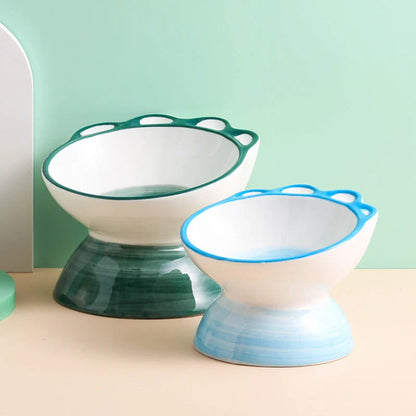 Ceramic pet bowl with 15-degree incline design in pink, green, and blue