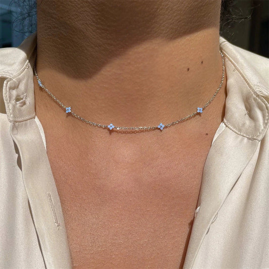 Elegant floral statement necklace in various color options, including golden blue, silver blue, golden green, and silver green, with an adjustable chain and high-quality construction.
