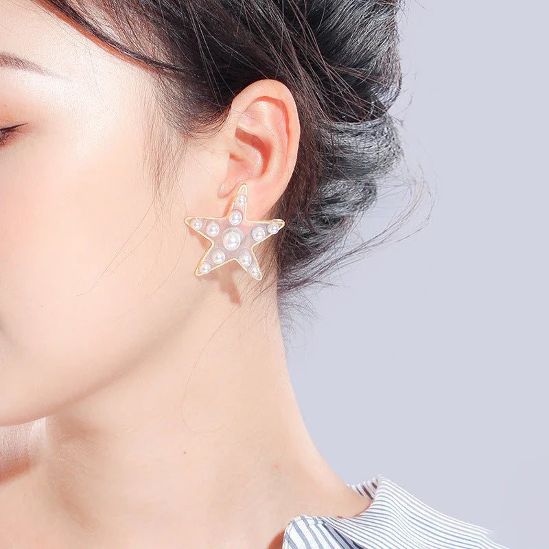 Charming peach heart and star stud earrings with elegant design and quality materials