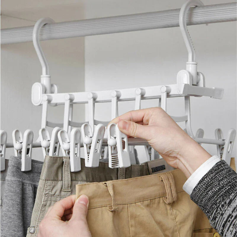 A white plastic hanging rack designed to maximise closet storage space by allowing users to vertically stack their clothes and accessories.