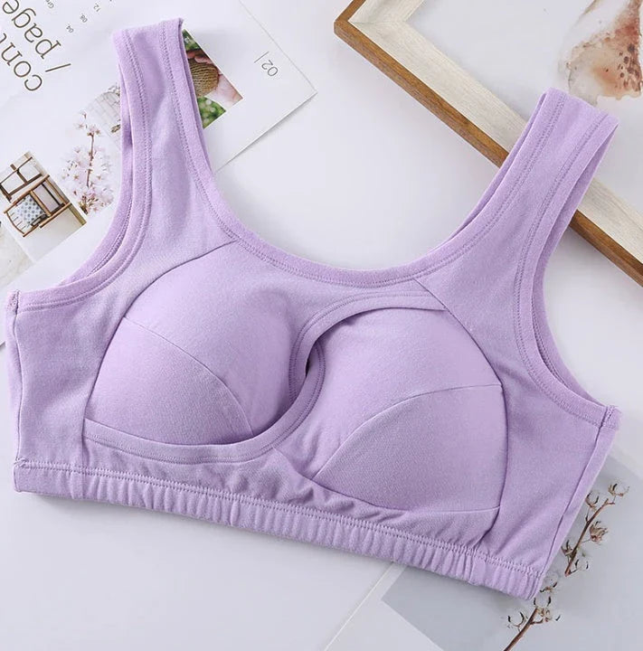 Supportive cotton sports bra with crossover design for lift and support, preventing sagging and bra lines