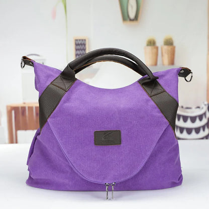 Stylish and versatile canvas shoulder bag with premium brass hardware and thoughtful interior organisation