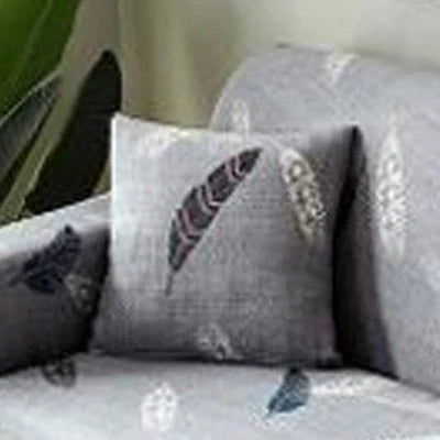 Stretchable geometric print sofa cover on a three-seater sofa