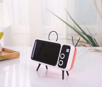 Vintage-inspired portable Bluetooth speaker with retro TV-style design and sleek, compact body